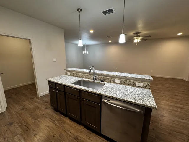 a bathroom with a sink a mirror and vanity