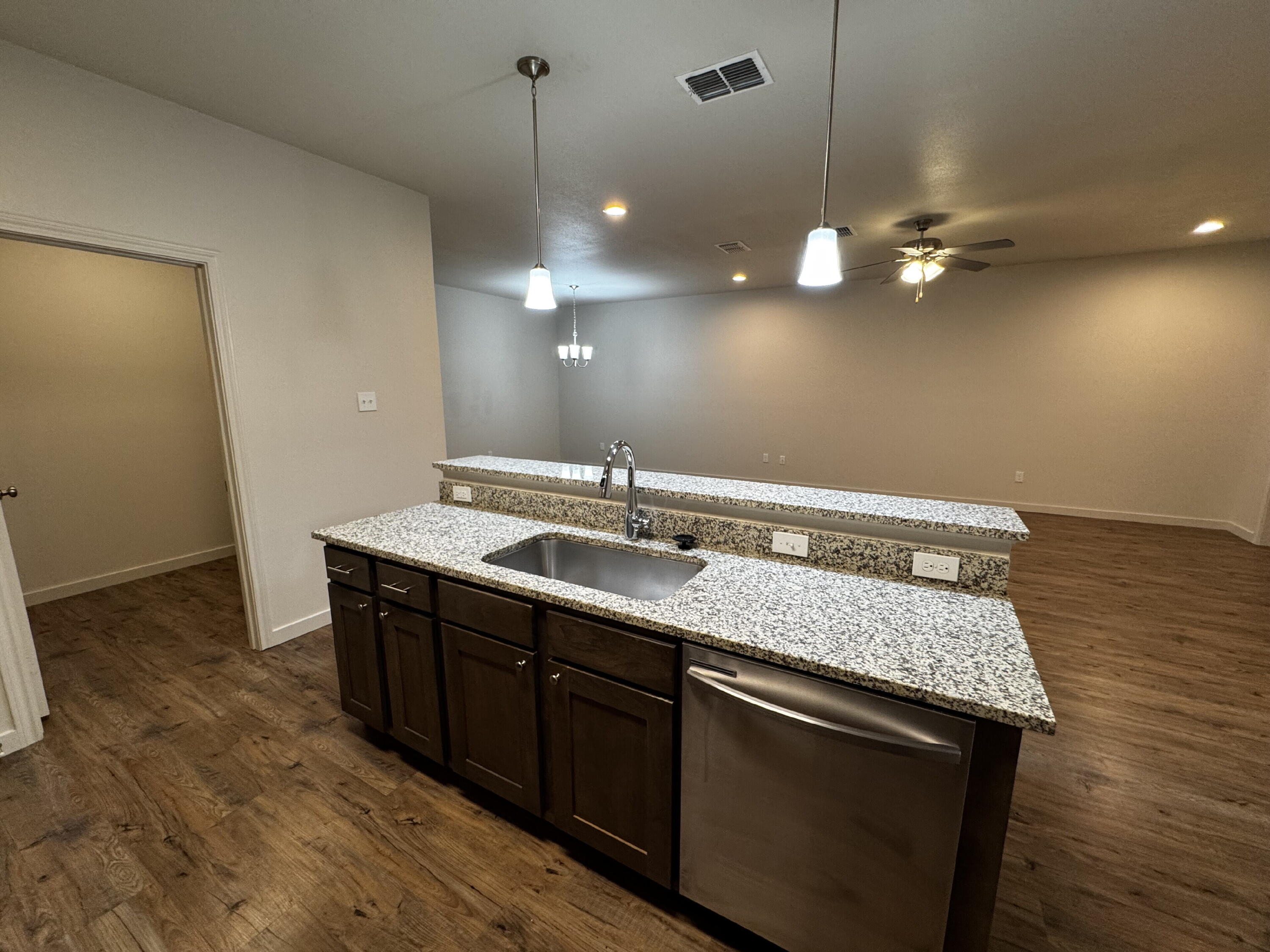 2613 135th Street Lubbock, TX 79423 - Photo 6 of 15 a bathroom with a sink a mirror and vanity