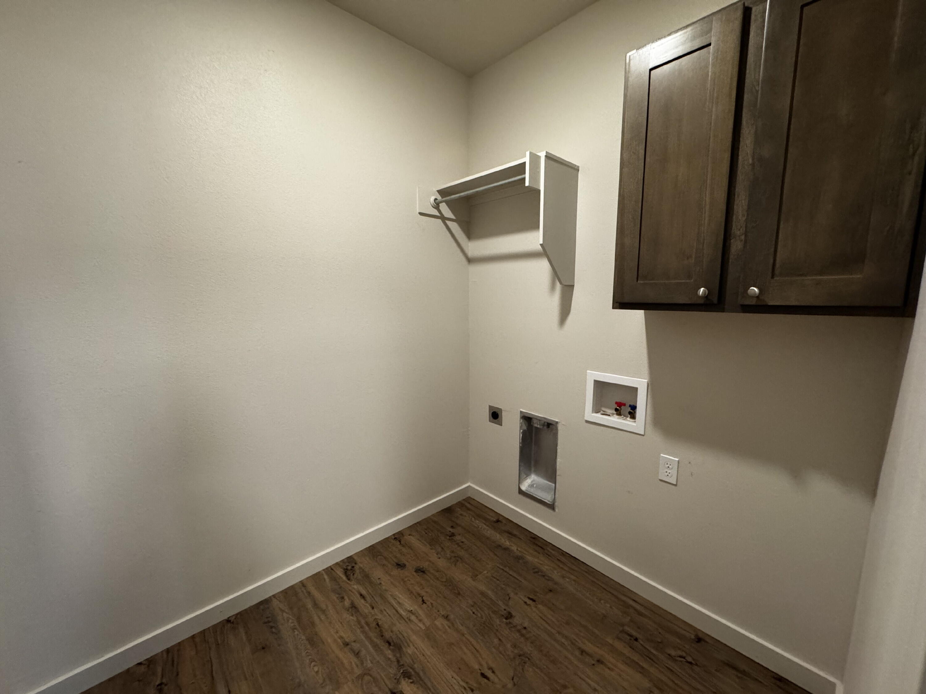 2613 135th Street Lubbock, TX 79423 - Photo 7 of 15 a view of small space with wooden floor and cabinet