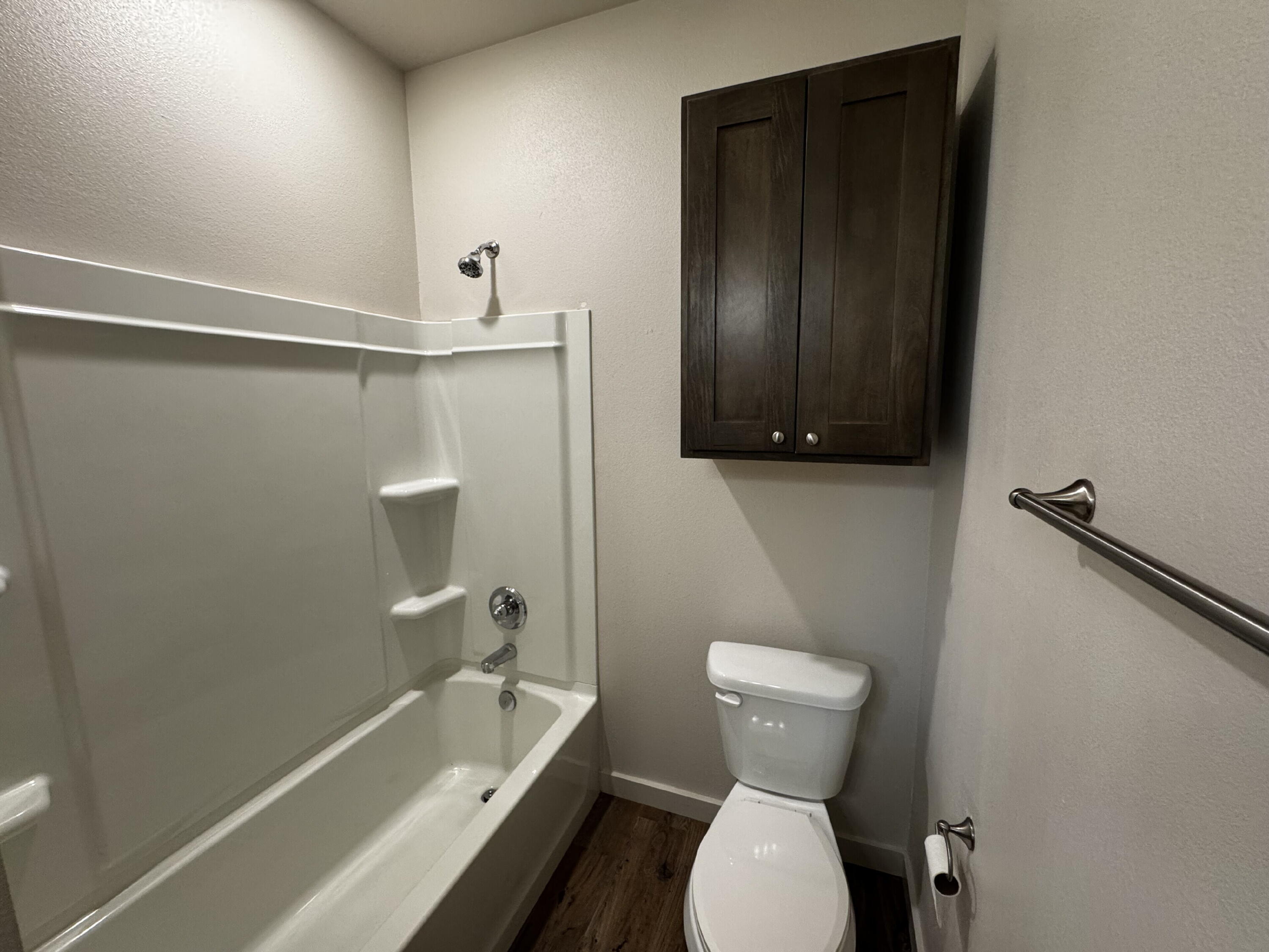 2613 135th Street Lubbock, TX 79423 - Photo 10 of 15 a bathroom with a toilet sink and shower