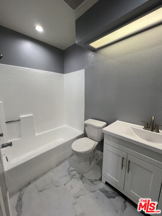 7639 Kester Avenue, Unit 5 Van Nuys, CA 91405 - Photo 15 of 21 a bathroom with a sink a toilet and shower