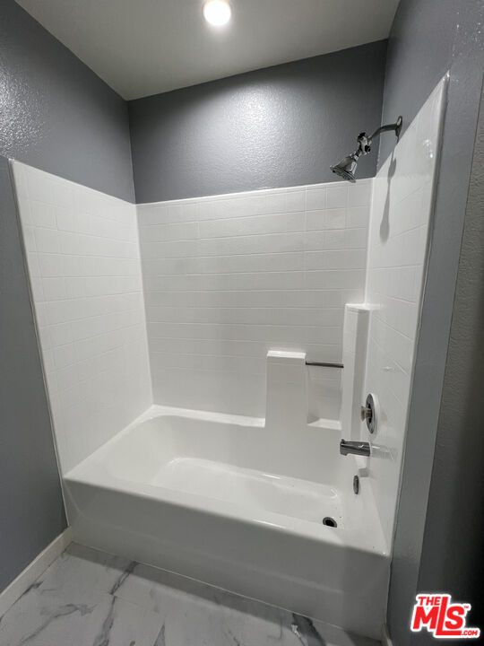7639 Kester Avenue, Unit 5 Van Nuys, CA 91405 - Photo 18 of 21 a bathroom with a bathtub and a shower
