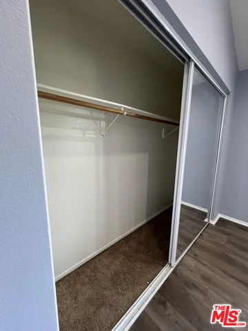 a living room with a black gate next to a window