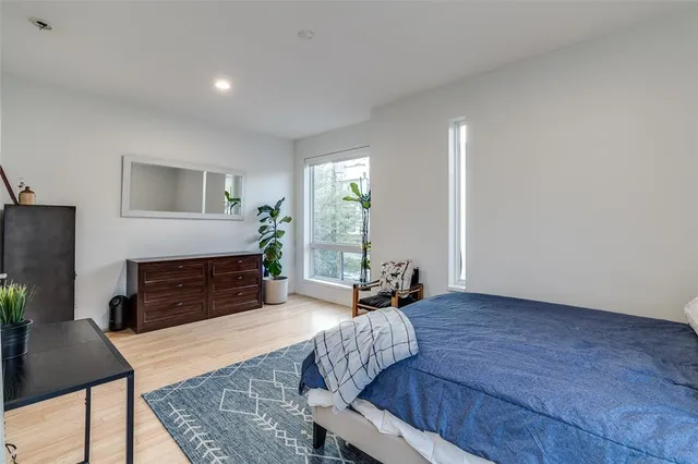 a living room with furniture rug and a fireplace