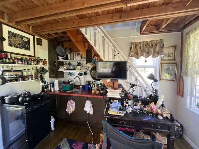 a room with lots of wooden furniture