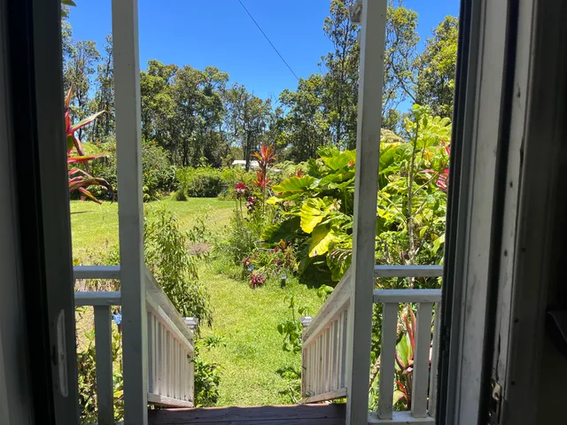 a view of a garden from a balcony