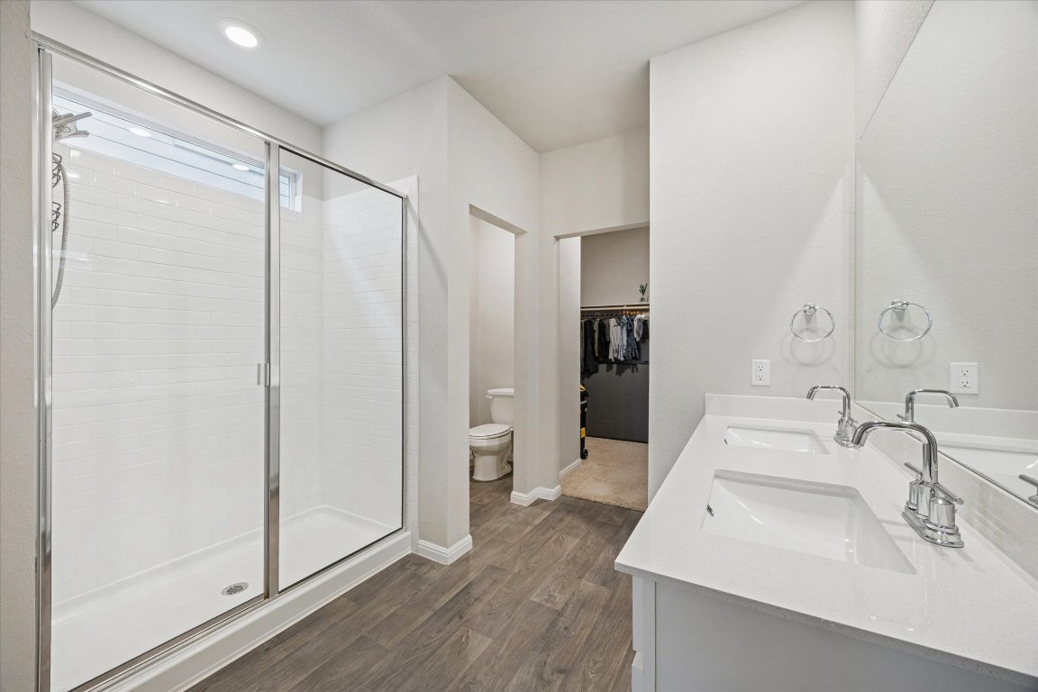 724 Aster Place Bastrop, TX 78602 - Photo 9 of 16 a bathroom with a sink and a mirror