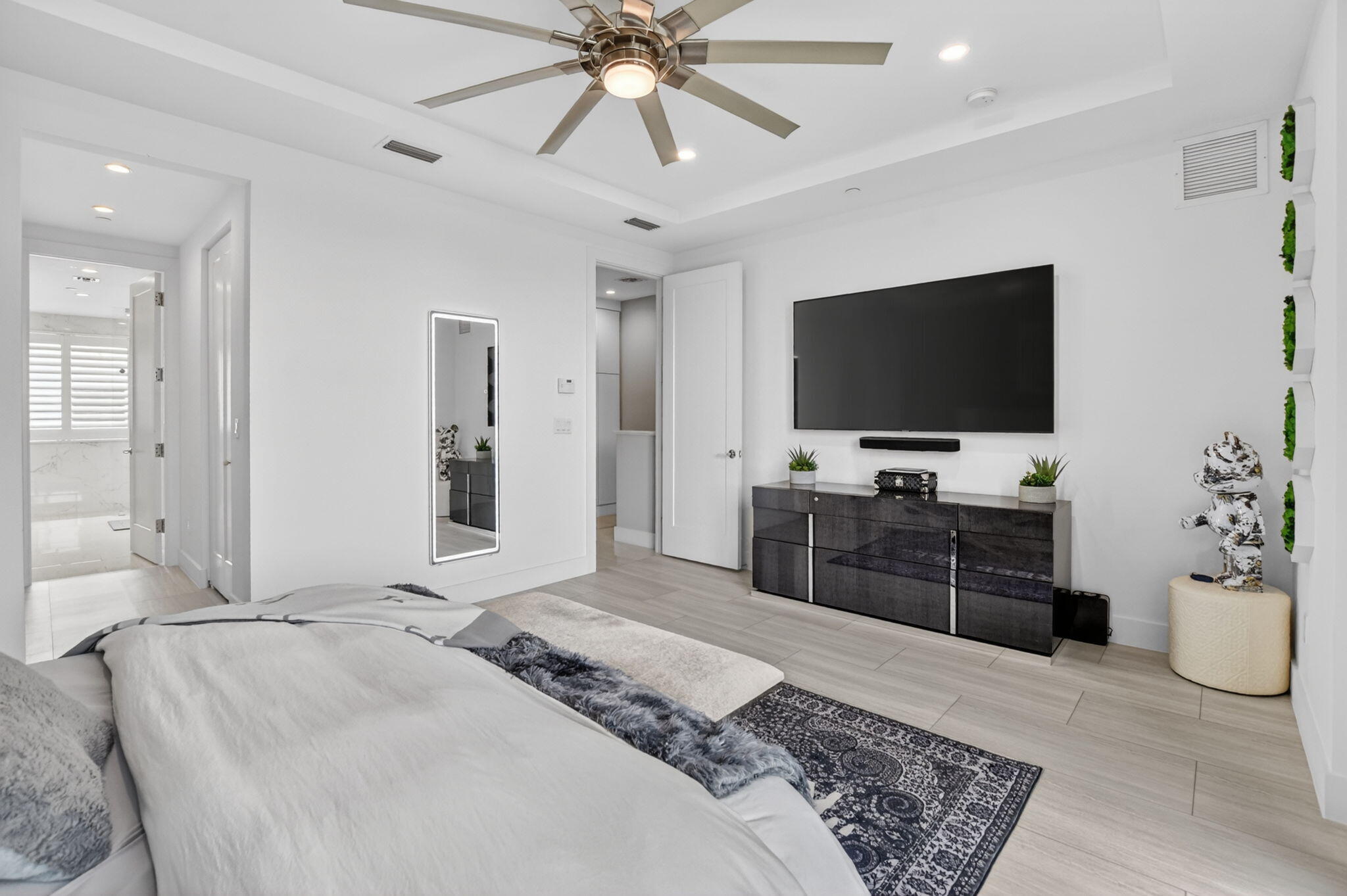 4021 Northwest 18th Way Boca Raton, FL 33431 - Photo 24 of 37 a bedroom with a bed and a flat screen tv