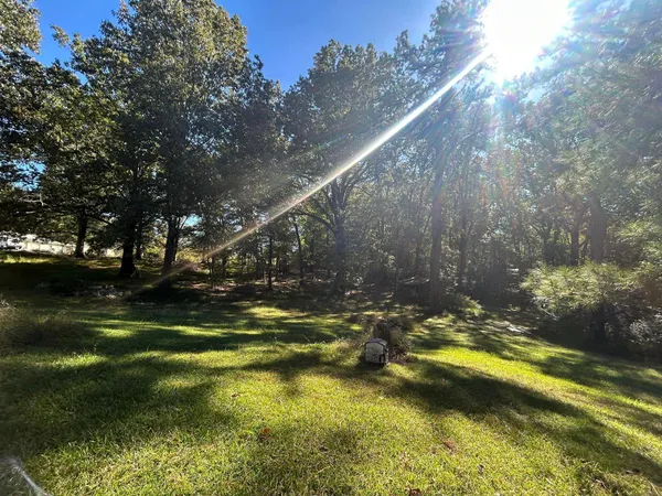 a view of swimming pool from a lake view