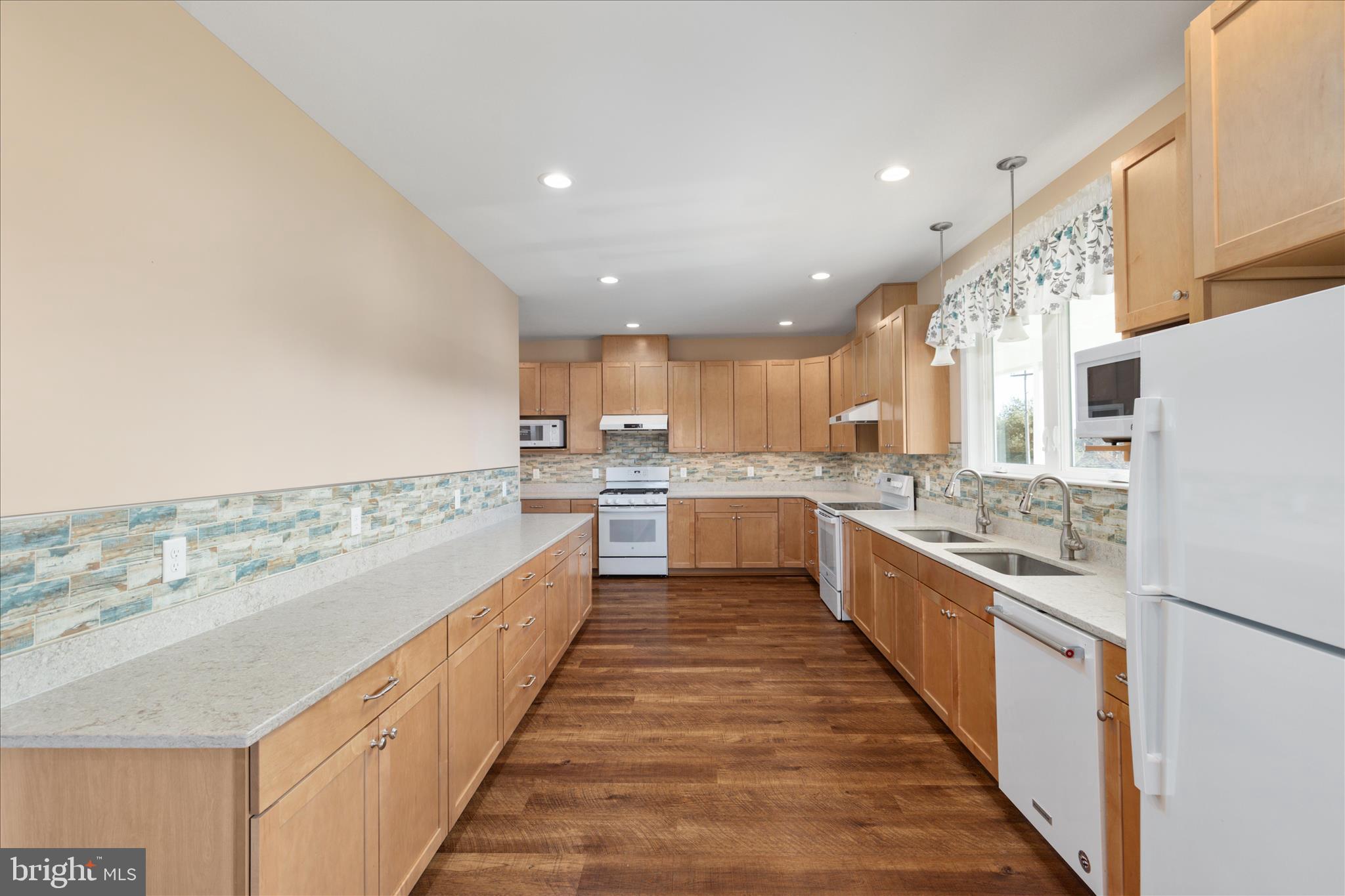 199 Laurel Grove Road Winchester, VA 22602 - Photo 15 of 97 a large kitchen with stainless steel appliances and a sink
