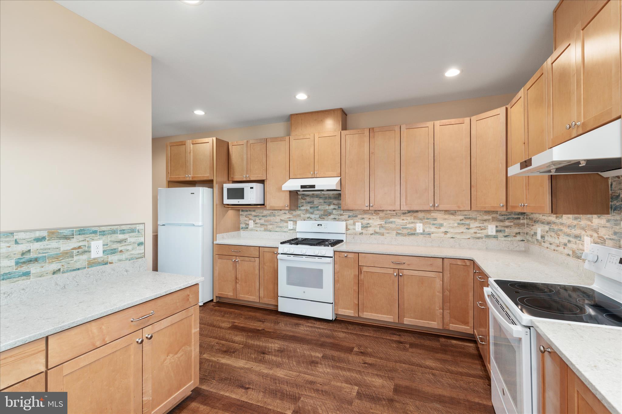 199 Laurel Grove Road Winchester, VA 22602 - Photo 16 of 97 a kitchen with stainless steel appliances granite countertop a stove a sink and a refrigerator