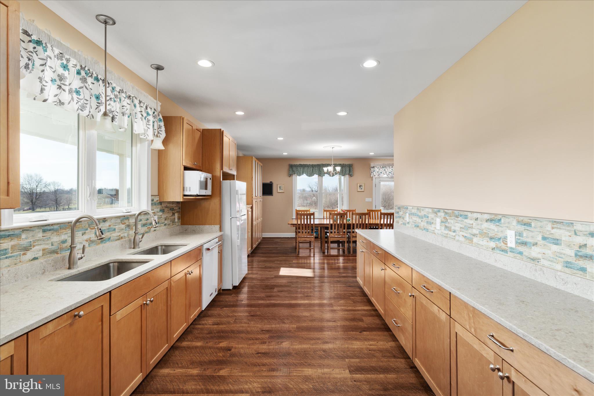 199 Laurel Grove Road Winchester, VA 22602 - Photo 18 of 97 a large white kitchen with a large window and furniture