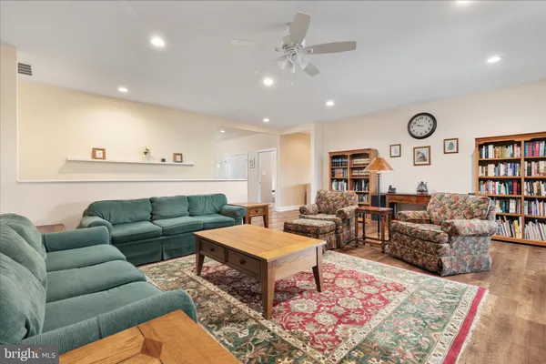 a large kitchen with stainless steel appliances and a sink