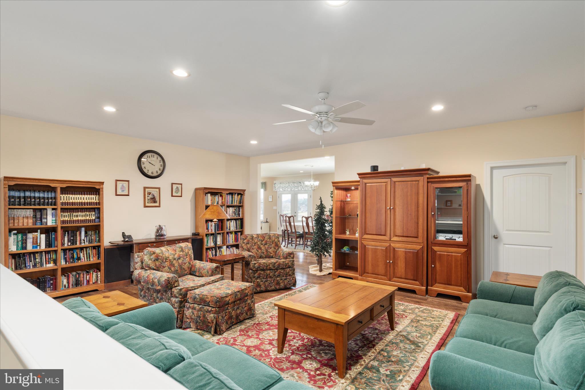 199 Laurel Grove Road Winchester, VA 22602 - Photo 10 of 97 a living room with fireplace furniture and a book shelf