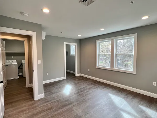 a view of an empty room with a window