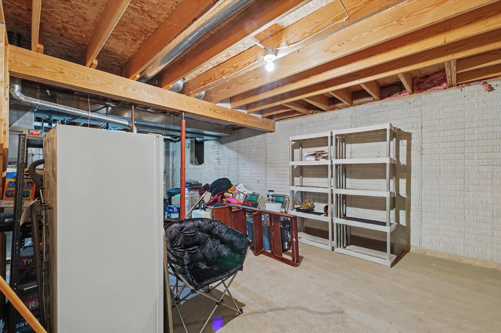 4409 Copper Ridge Road Champaign, IL 61822 - Photo 34 of 40 a view of a storage room with a fridge