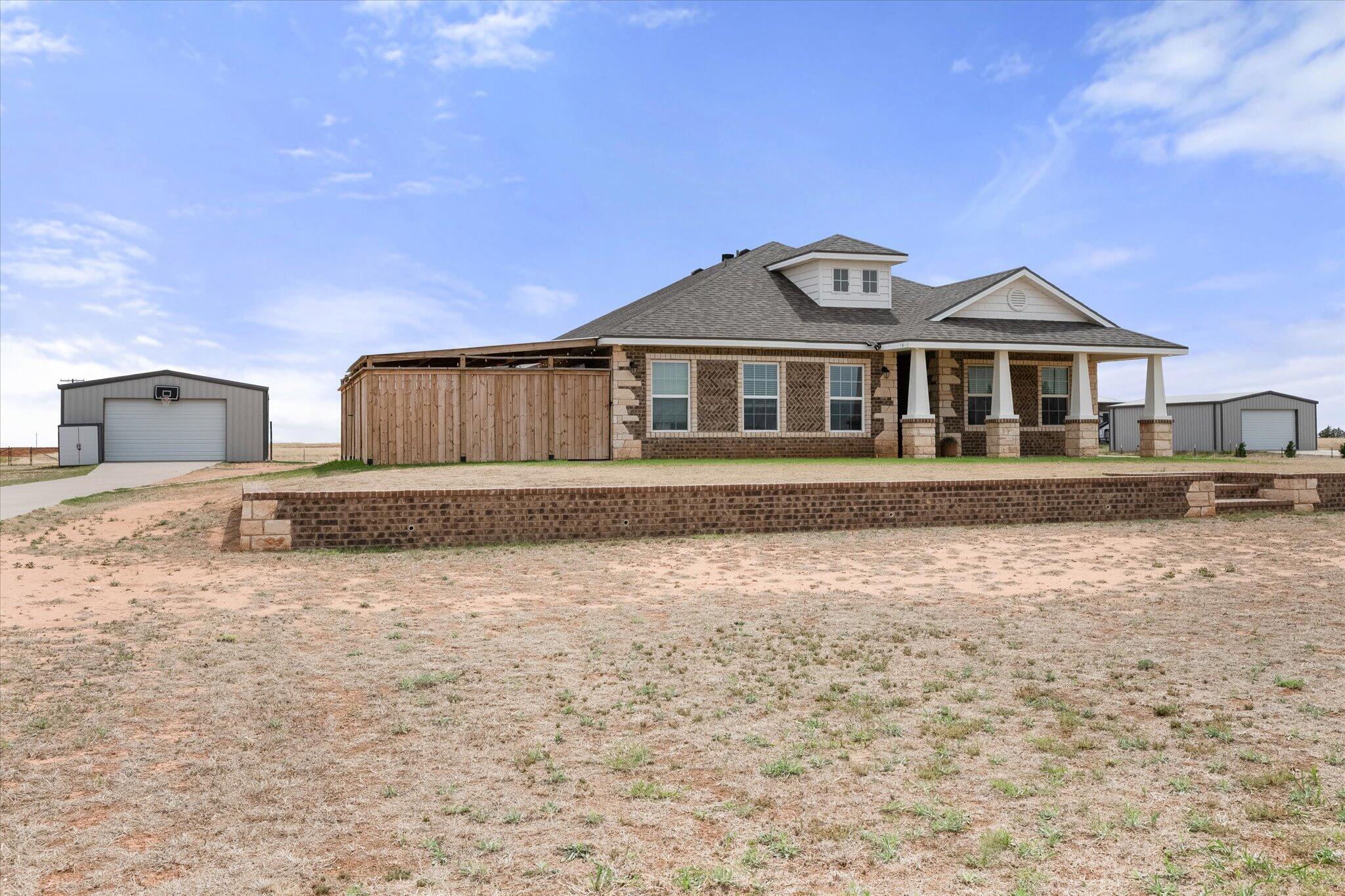 1429 Fm 211 Wilson, TX 79381 - Photo 2 of 43 a front view of a house with a yard