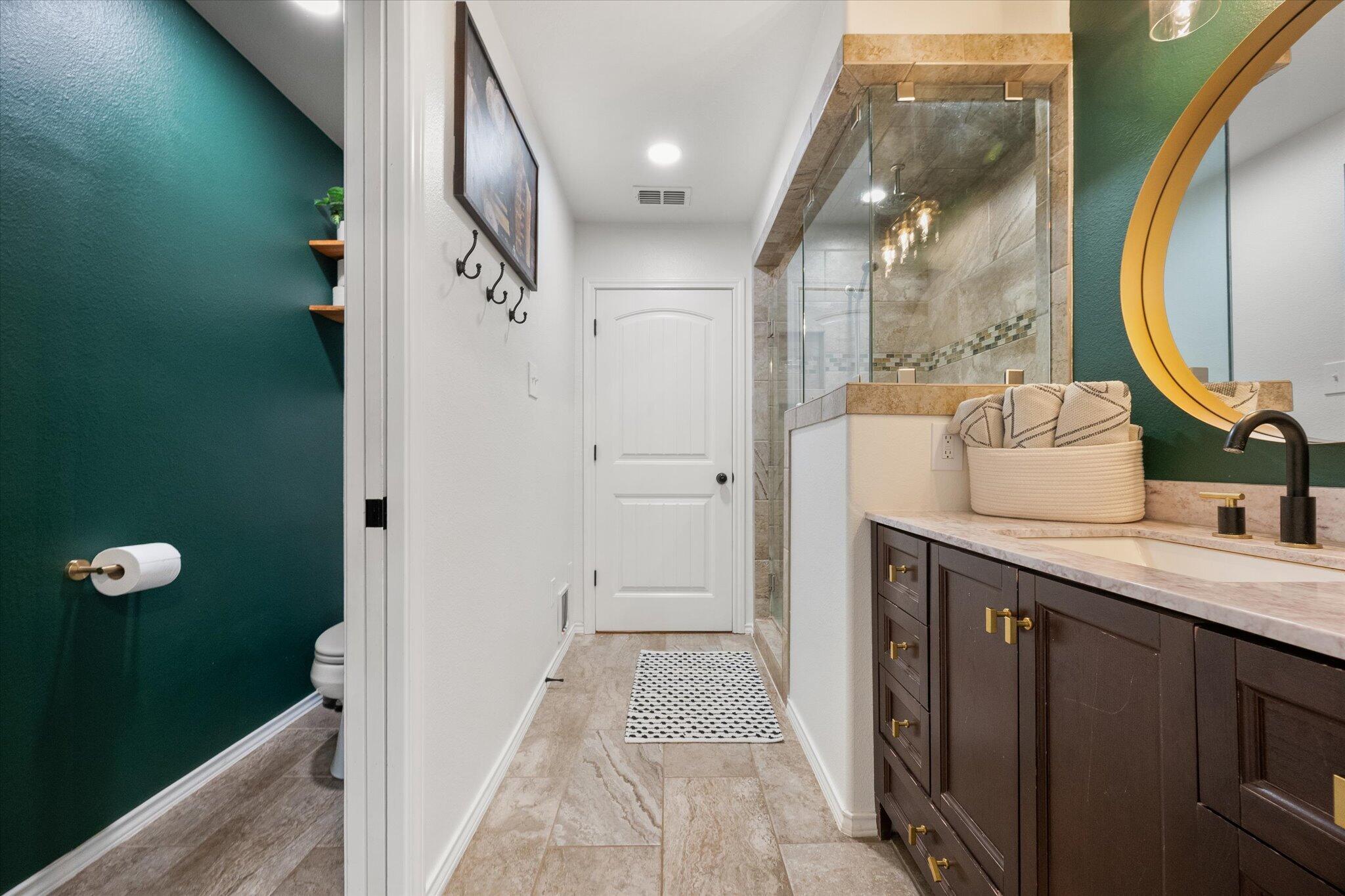 1429 Fm 211 Wilson, TX 79381 - Photo 22 of 43 a bathroom with a double vanity sink and a mirror