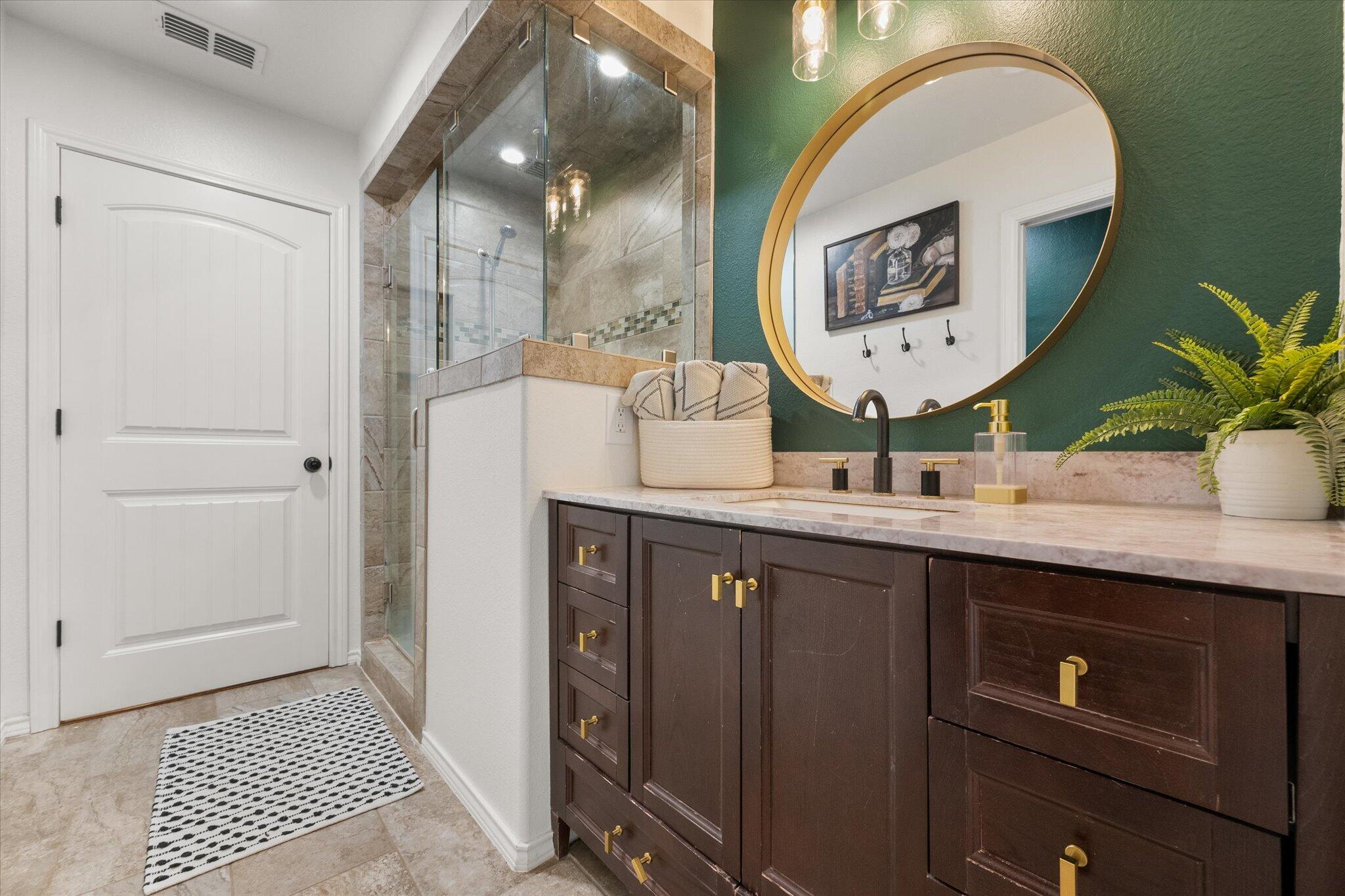 1429 Fm 211 Wilson, TX 79381 - Photo 23 of 43 a bathroom with a double vanity sink and a mirror