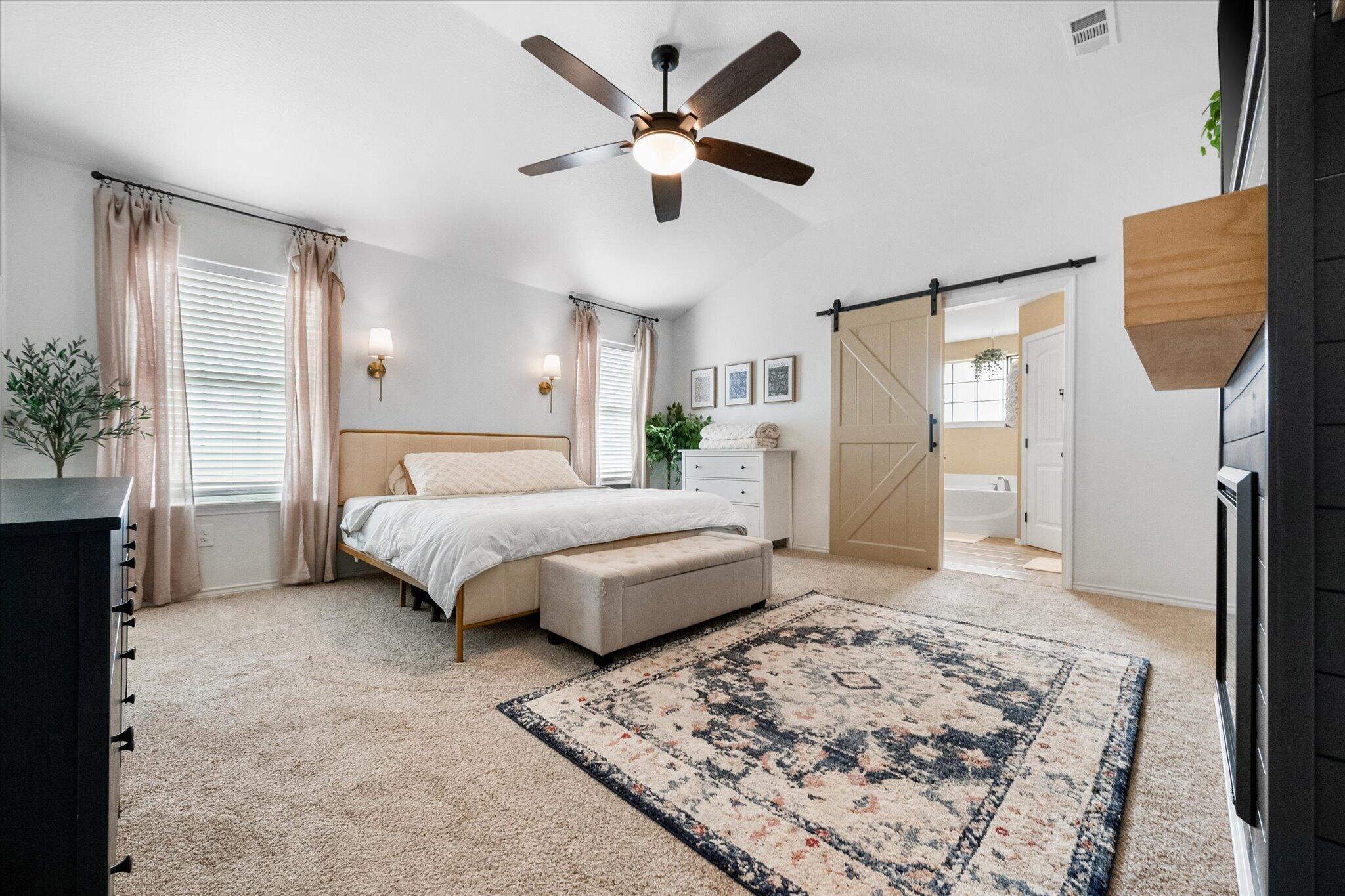 1429 Fm 211 Wilson, TX 79381 - Photo 25 of 43 a bedroom with a bed and a couch
