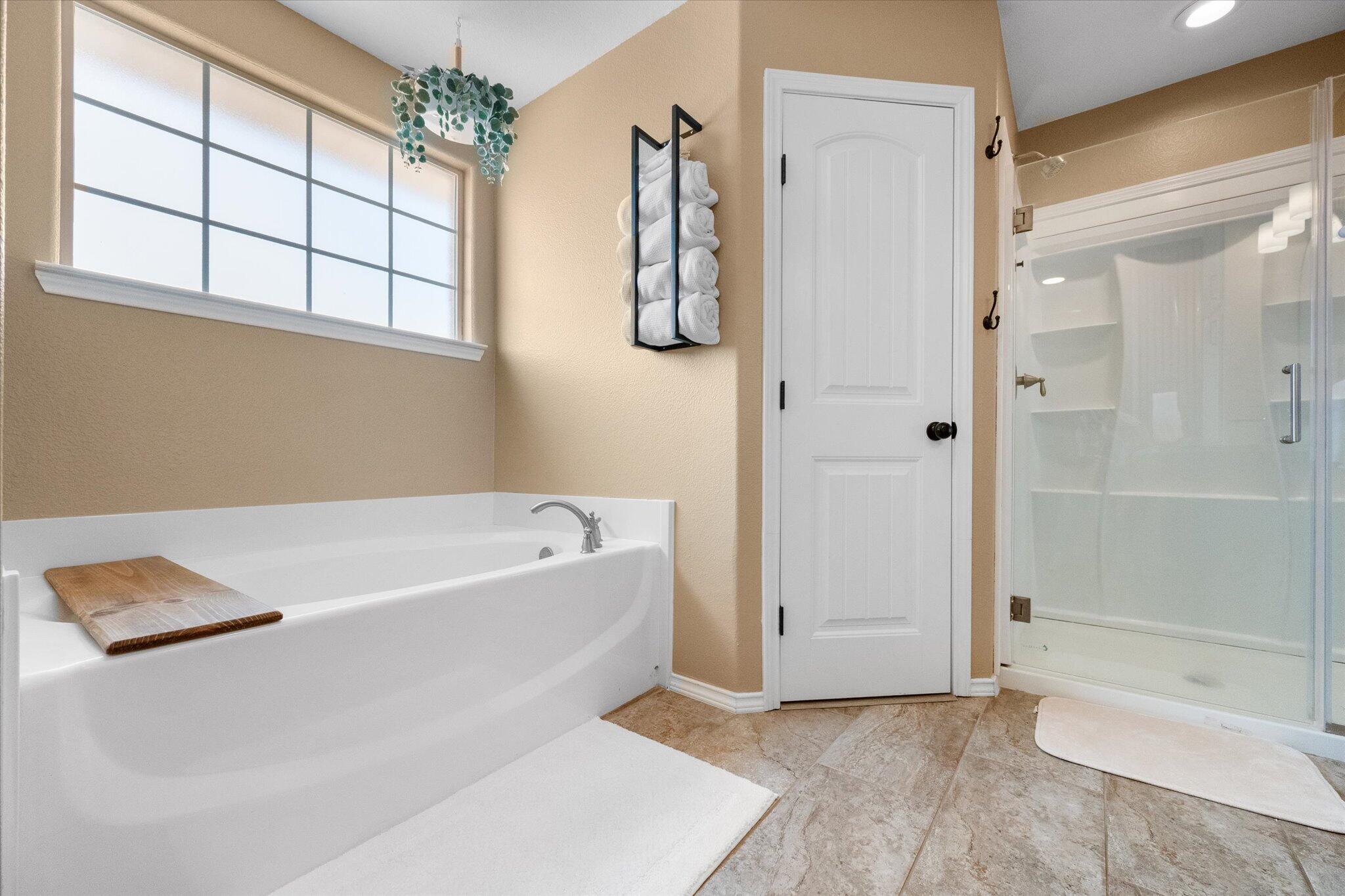1429 Fm 211 Wilson, TX 79381 - Photo 31 of 43 a bathroom with a tub shower and a sink