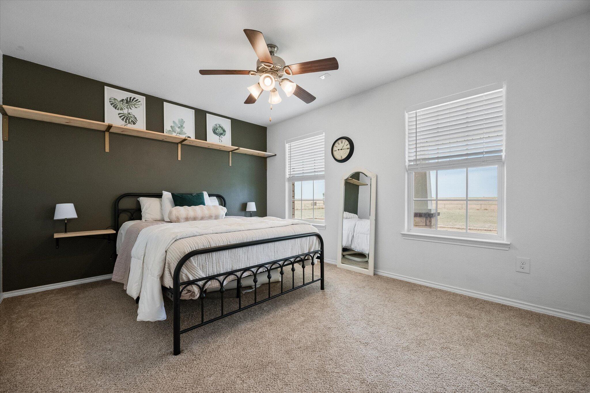 1429 Fm 211 Wilson, TX 79381 - Photo 33 of 43 a bedroom with a bed mirror and a window