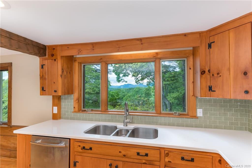2468 Peniel Road Columbus, NC 28722 - Photo 12 of 47 a kitchen that has a sink and a window