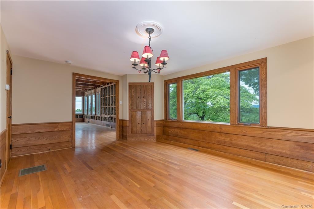2468 Peniel Road Columbus, NC 28722 - Photo 14 of 47 a view of hall with wooden floor and a large window