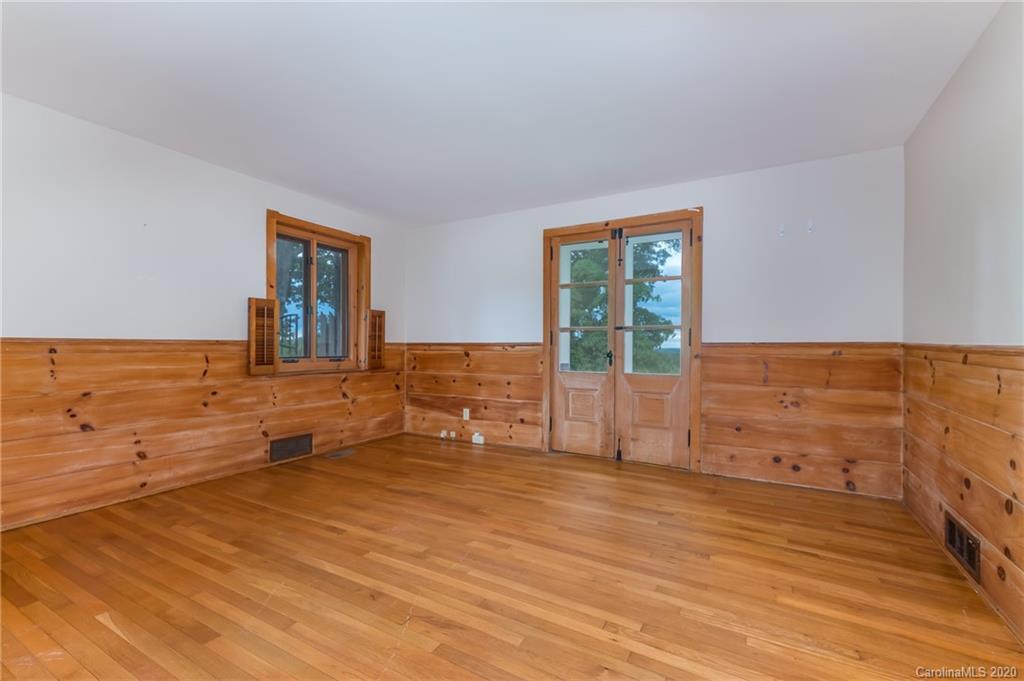 2468 Peniel Road Columbus, NC 28722 - Photo 25 of 47 wooden floor with an empty room