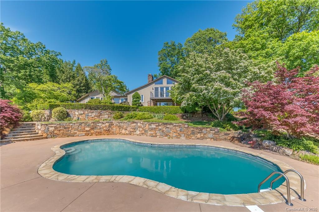 2468 Peniel Road Columbus, NC 28722 - Photo 28 of 47 a view of a swimming pool with a yard