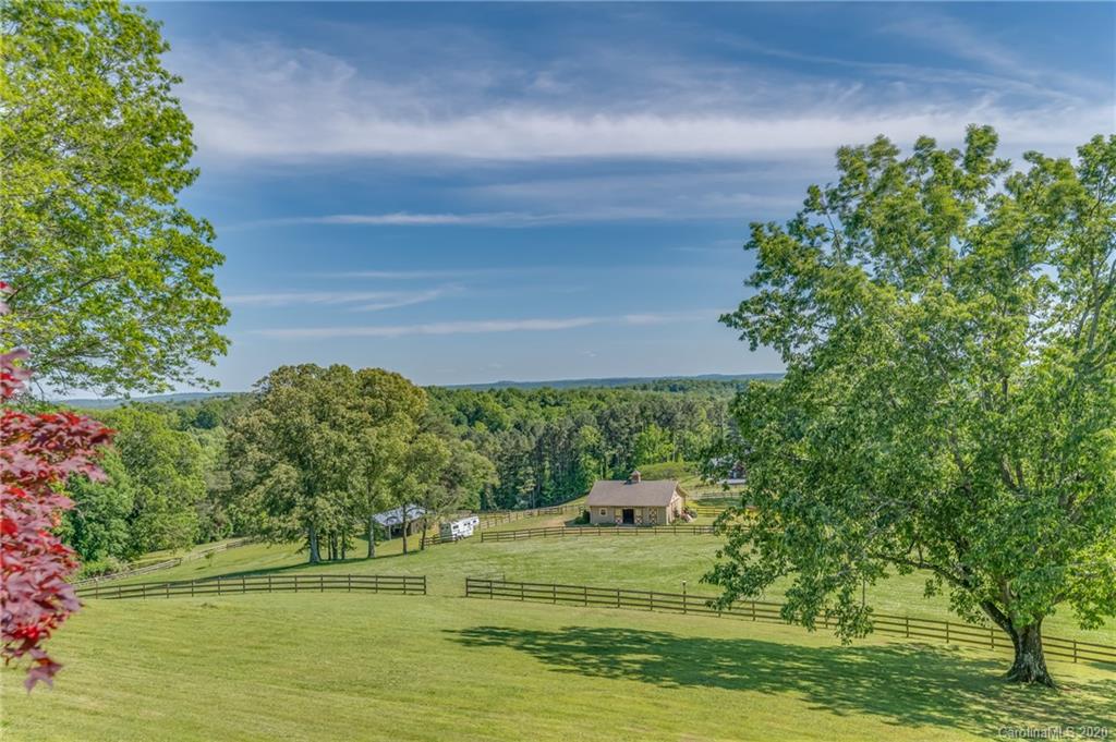 2468 Peniel Road Columbus, NC 28722 - Photo 29 of 47 a view of a golf course with a lake