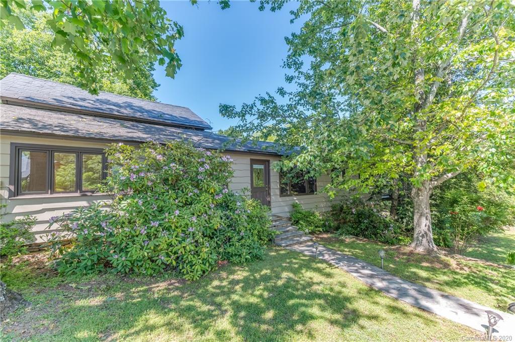 2468 Peniel Road Columbus, NC 28722 - Photo 35 of 47 a view of a house with a yard