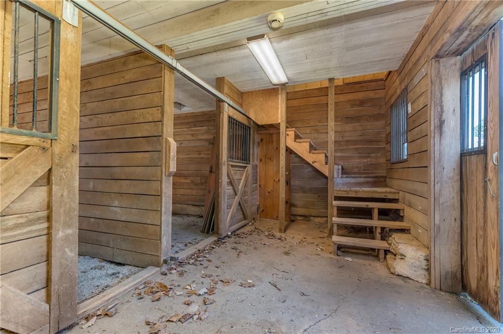 2468 Peniel Road Columbus, NC 28722 - Photo 40 of 47 a view of an empty room with stairs