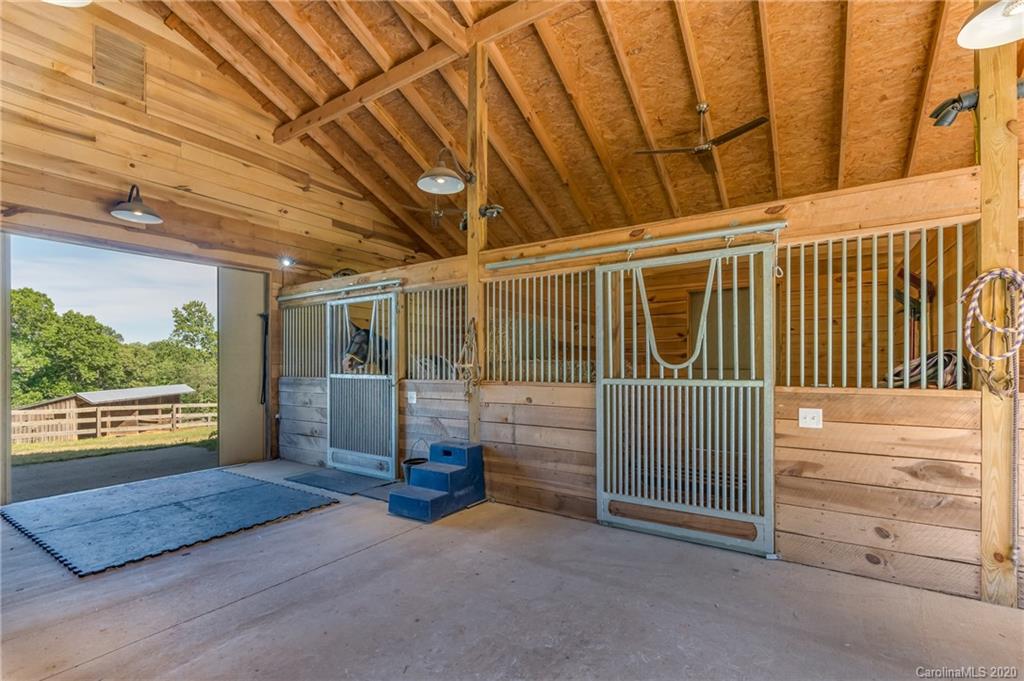 2468 Peniel Road Columbus, NC 28722 - Photo 45 of 47 a view of a porch with wooden floor and iron fence