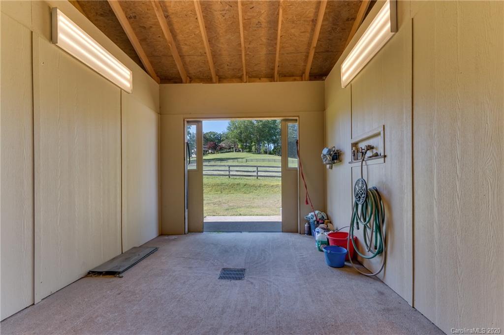 2468 Peniel Road Columbus, NC 28722 - Photo 47 of 47 a view of a room with gym equipment and a large window