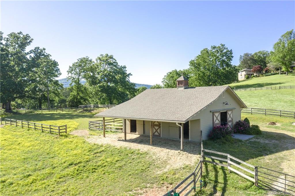 2468 Peniel Road Columbus, NC 28722 - Photo 7 of 47 a view of a house with pool and a yard