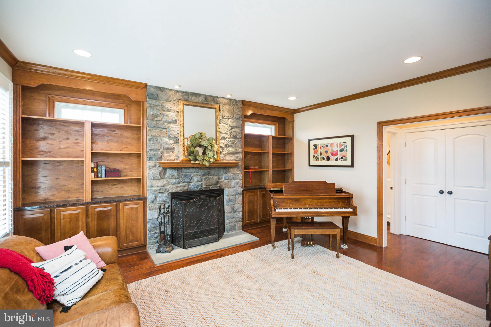 Conservatory room with wood burning fireplace