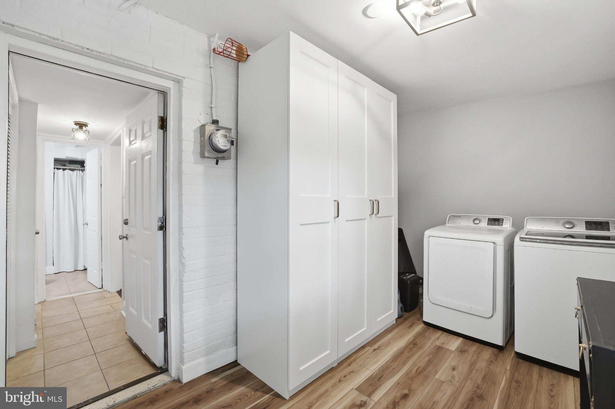 49 West Reed Avenue Alexandria, VA 22305 - Photo 27 of 29 Modern laundry space with sleek storage.