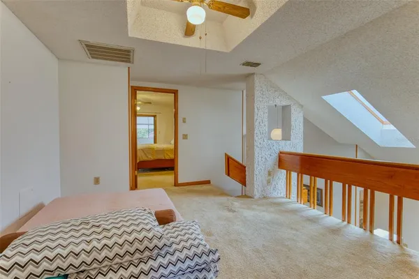a view of a balcony with flower plants