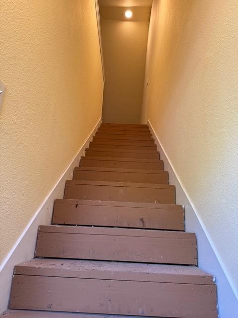 255 Chaparrals Run Azle, TX 76020 - Photo 8 of 35 Stairs leading to room above garage