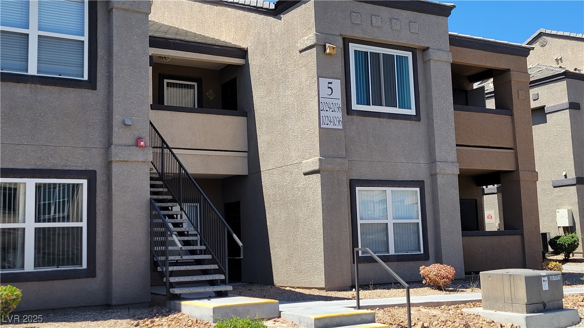 6650 West Warm Springs Road, Unit 1032 Las Vegas, NV 89118 - Photo 1 of 17 View of property featuring stairway