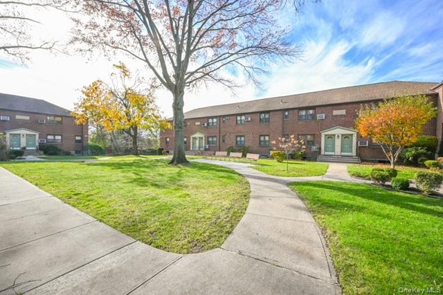 245-12 62nd Avenue, Unit G/3 LOWER Queens, NY 11362 - Photo 2 of 18 a view of yard with swimming pool and green space
