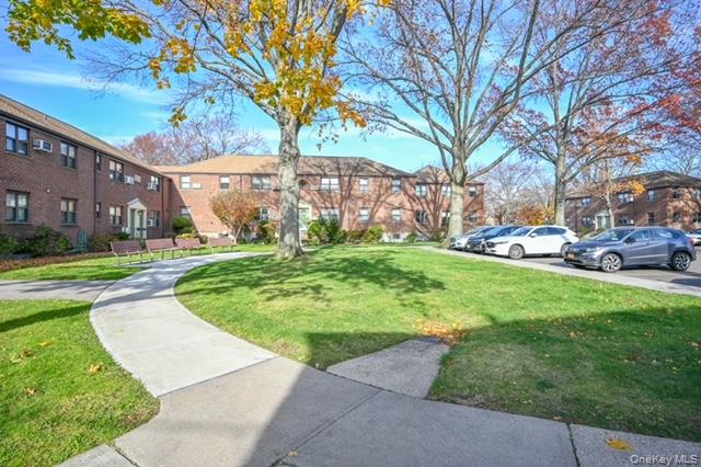 245-12 62nd Avenue, Unit G/3 LOWER Queens, NY 11362 - Photo 3 of 18 a tall tree in middle of the park