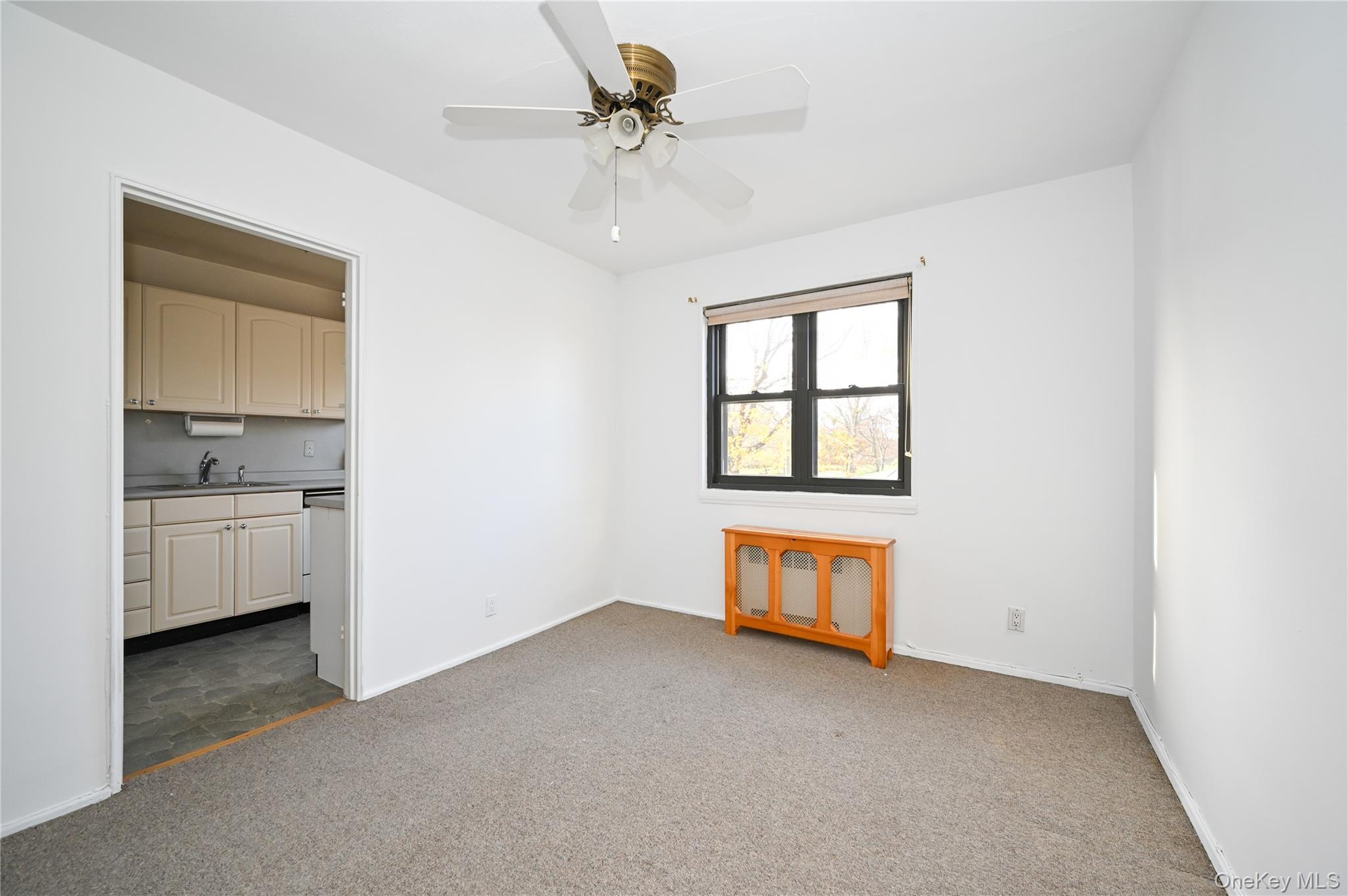 245-12 62nd Avenue, Unit G/3 LOWER Queens, NY 11362 - Photo 8 of 18 a view of an empty room with a window