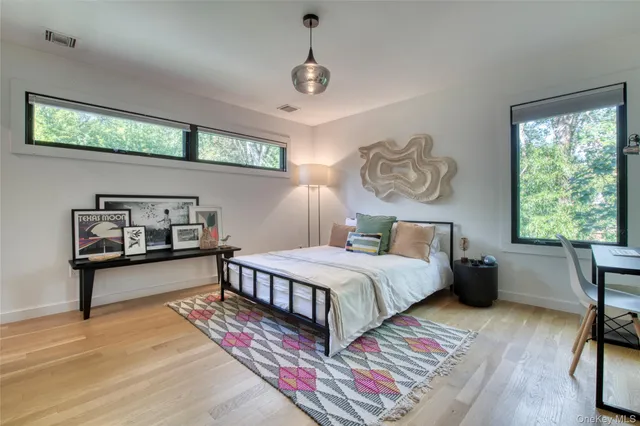 a bedroom with furniture and a window