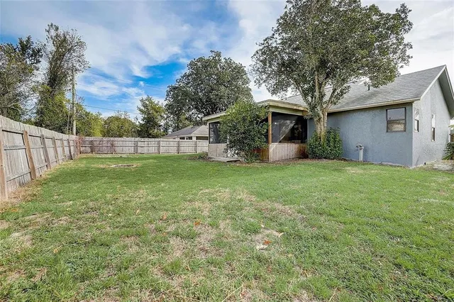 a view of a backyard with a small cabin