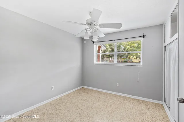 a view of a room that has a window in it