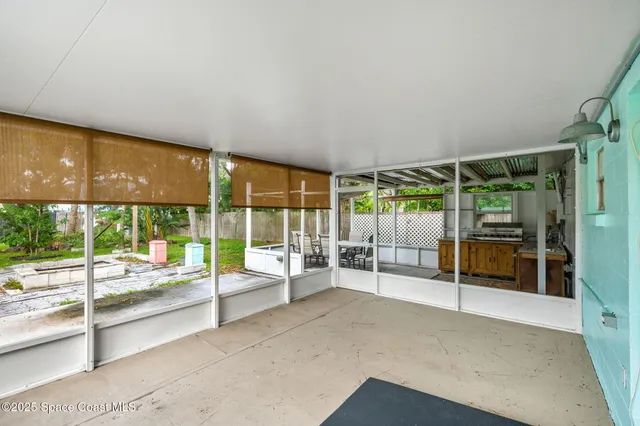 a view of an empty room with windows