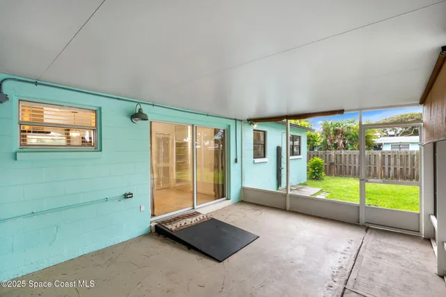 a bathroom with a granite countertop sink and a window