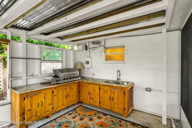 a view of a house with a yard and tree s